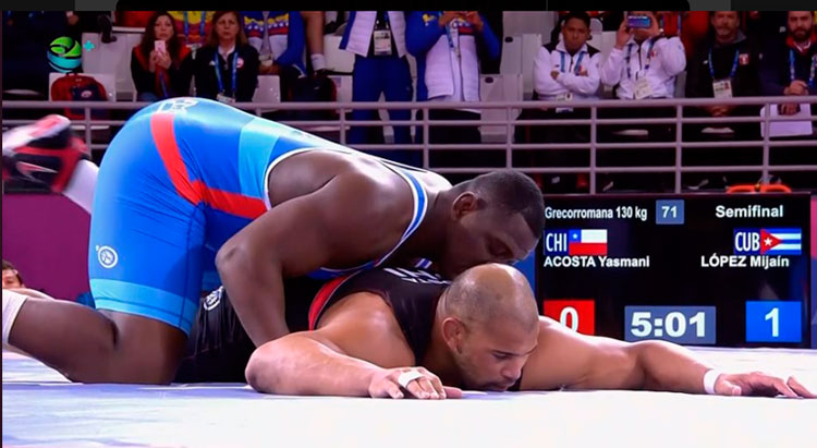 Mijaín López en combate contra el chileno de origen cubano Yasmani Acosta. Mijaín López en combate contra el chileno de origen cubano Yasmani Acosta.