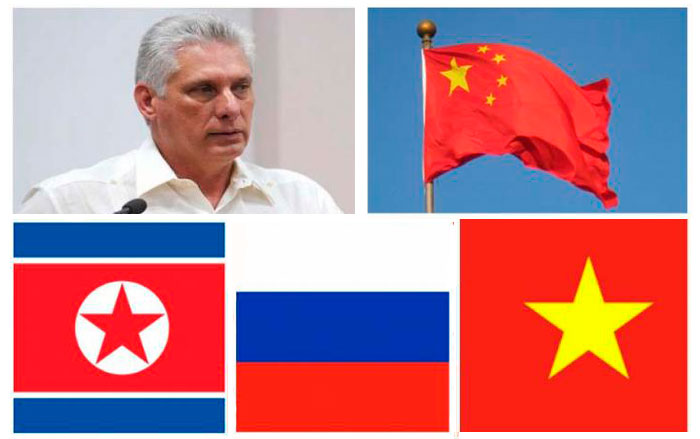 Presidente cubano, Miguel Díaz-Canel y banderas de países incluidos en su gira por Europa y Asia,