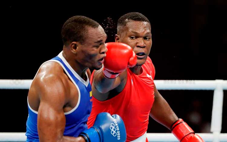 Dainier Peró, boxeador cubano, vence al colombiano Cristian Salcedo, en Tokio 2020. Dainier Peró, boxeador cubano, vence al colombiano Cristian Salcedo, en Tokio 2020.