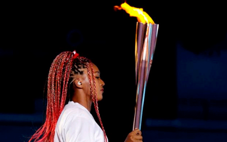Tenista japonesa Naomi Osaka, encargada de encender la llama olímpica en Tokio 2020. Tenista japonesa Naomi Osaka, encargada de encender la llama olímpica en Tokio 2020.